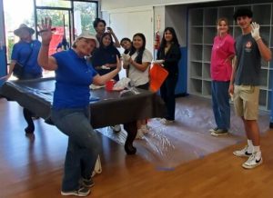 Avid students working alongside Rotary to help with B & G club patio update